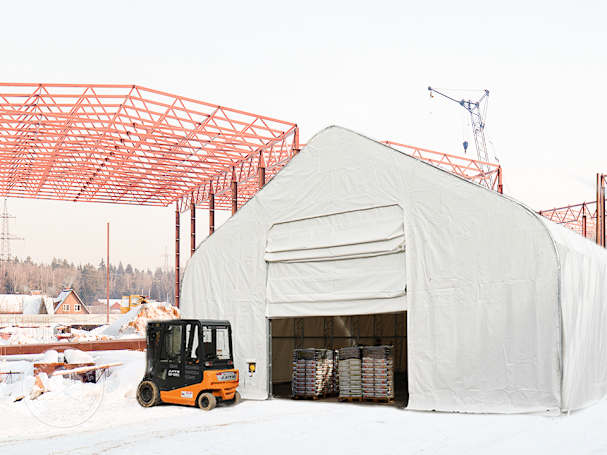 Large industrial tent with wide entrance gate