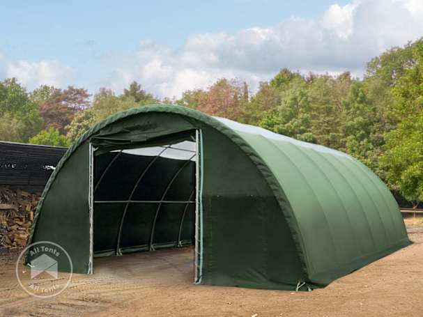 Green arched fabric building with PVC cover and steel frame structure for storage