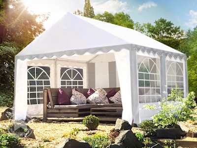 4x4 white marquee with arched windows set up for a garden party