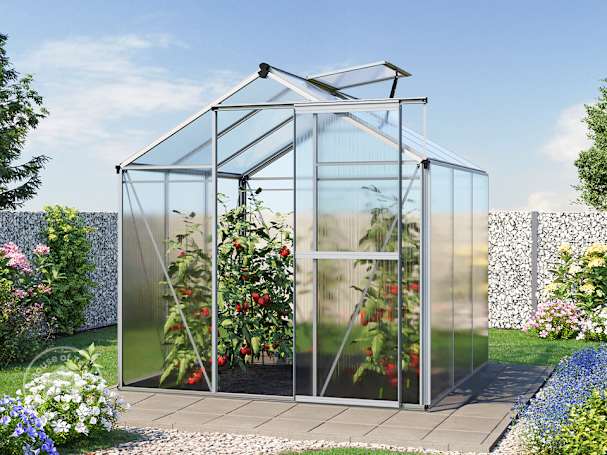 a small walk-in greenhouse with tomato plants inside in the middle of a garden