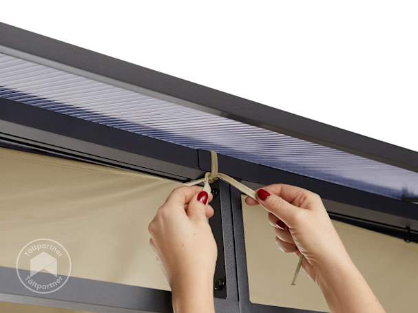 Knyta solsegel til paviljong