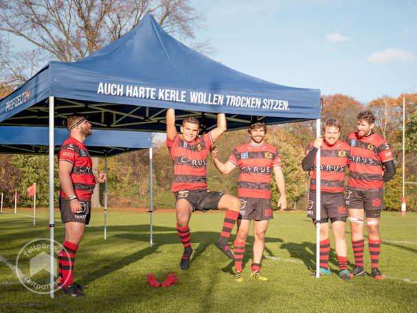 rugby med en easy up pavillon