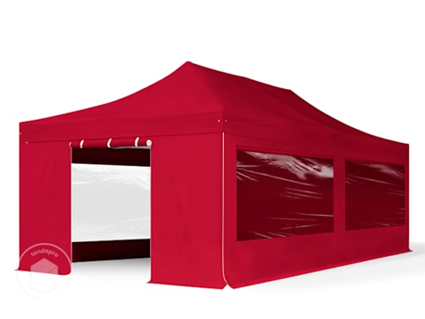 Um pavilhão dobrável vermelho com painéis laterais